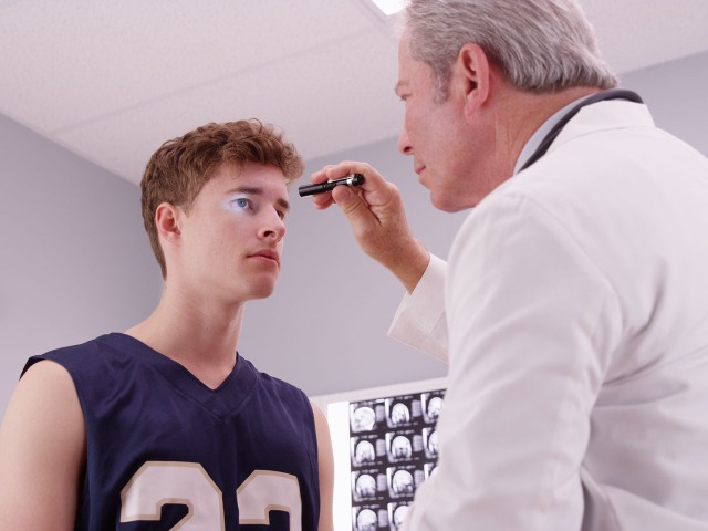 Eye Doctor Checking Athletes Eyes